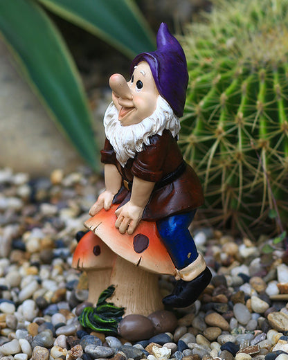 Joyful Gnome Sitting on a Mushroom Garden Statue